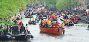 Queen's Day boats in a canal in Amsterdam, Holland. http://www.enjoy-europe.com/Starting-s.jpg