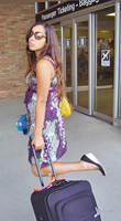 Stephanie is ready to kick off at the airport. http://www.enjoy-europe.com/StephanieAtAirport.jpg