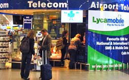 Pick up a mobile phone at Amsterdam's Schiphol Airport.