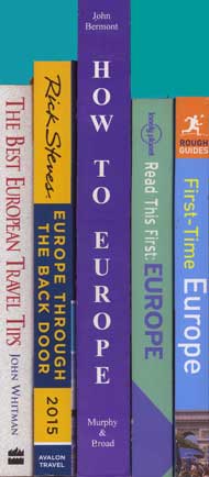 The spines 
of five travel books.