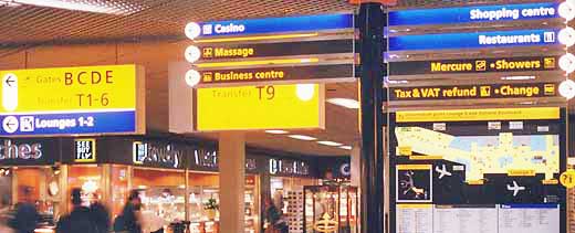 Street signs point the way in Schiphol Airport, Amsterdam.