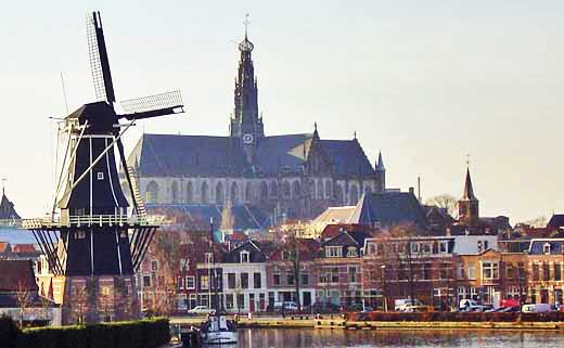 This view of the De Adriaan windmill and the Grote Kerk welcomes you to Haarlem, The Netherlands when you take the train from Amsterdam.