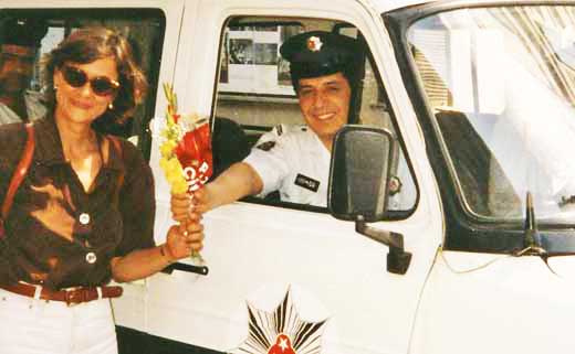 A police officer gives Elizabeth a bouquet of flowers in Istanbul, Turkey.