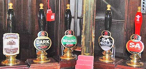 Ale taps at a pub in Cardiff, Wales.