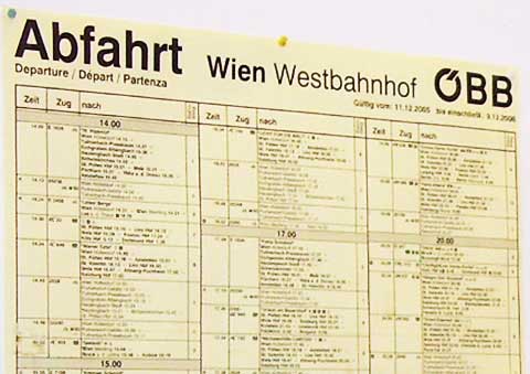 The train departure schedule is posted at the West Train Station in Vienna, Austria.