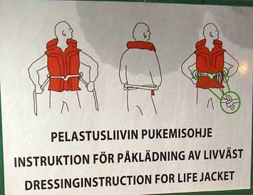 Life jacket instruction poster on the Silja Symphony sailing from Stockholm, Sweden to Helsinki, Finland.