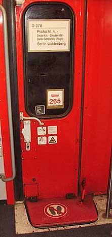 Typical train car door sign indicating the class of service, seat numbers, and smoking or not.