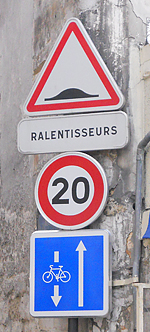 A 20 km/hr speed limit sign in Paris, France. http://www.enjoy-europe.com/hte/chap18/Chap18images/0881Ralentisseurs.jpg