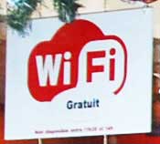 The WiFi icon on the window of a sandwich shop in Paris.